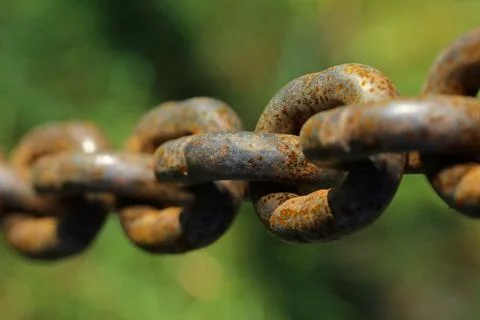 Rusty chain with blurred background Stock Photos