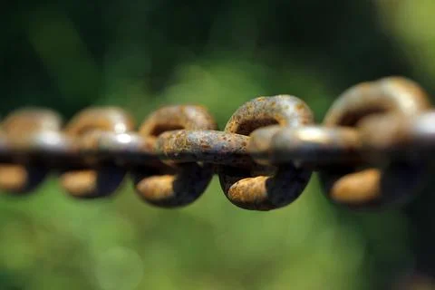 Rusty chain with blurred background Stock Photos