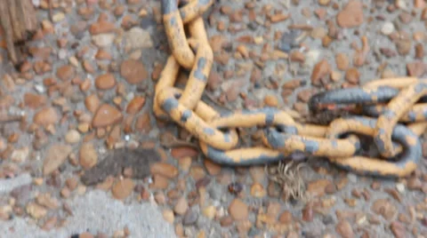Rusty Chain on Ground Stock Footage 33754860