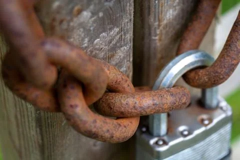Rusty Chain Held by Padlock Stock Photos