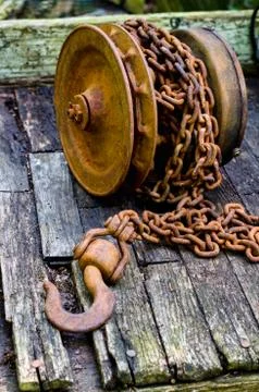 Rusty chain with large hook Stock Photos