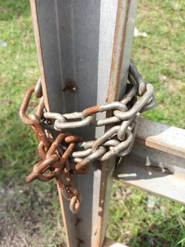 Rusty Chain on Metal Post Stock Photos