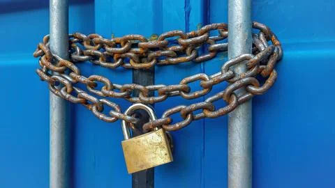 Rusty chain with a padlock Stock Photos