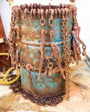 Rusty chains in a barrel Stock Photos
