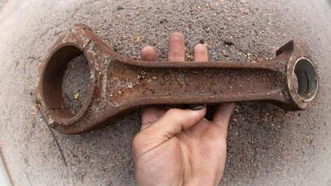 Rusty Connecting Rod in Hand: Old Engine Part Stock Photos