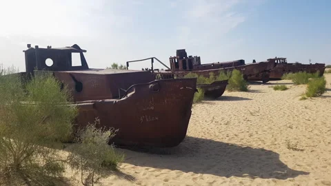 Rusty Corroded Abandoned Boats and Shipwrecks in Sand of Former Aral Sea, Stock Footage 248749407