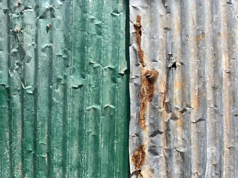 Rusty corrugated iron wall texture. Abstract background and texture for design. Stock Photos