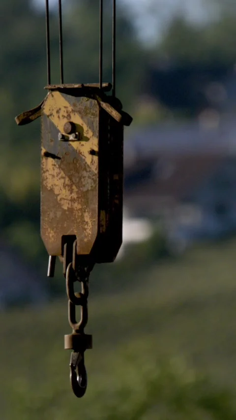 Rusty Crane Hook With Flaking Yellow Paint In Countryside Environment Stock Footage 335848229