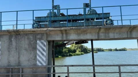 Rusty Crane Mechanism Standing Above River Channel Video stock 342514605