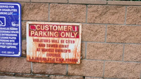 Rusty Customer Parking Only Sign Stock Footage 237842612