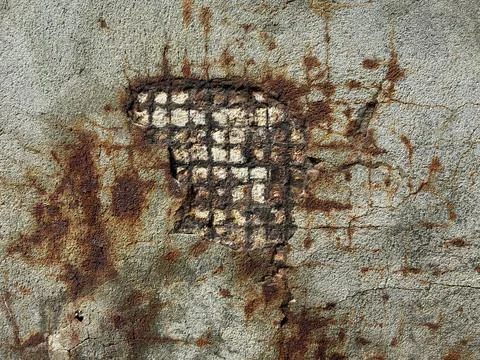 Rusty Damaged Wall Texture With Exposed Metal Mesh Stock Photos