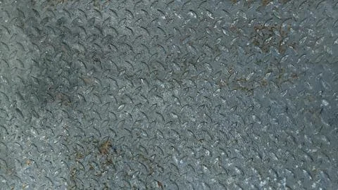 Rusty dark grey diamond plate texture background, weathered metal. Stock Photos