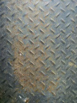 Rusty Diamond Plate Metal Surface With Industrial Texture and Weathered Steel Stock Photos