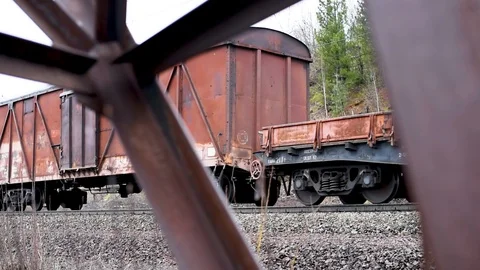 Rusty electric support on the background of a passenger train Stock-Footage 106197333
