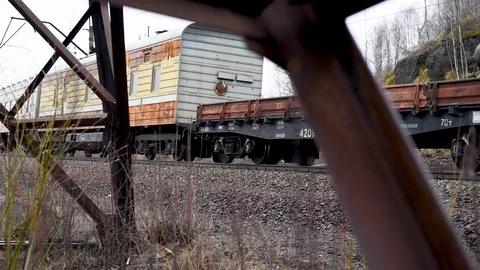 Rusty electric support on the background of a passenger train Stock Footage 106197367
