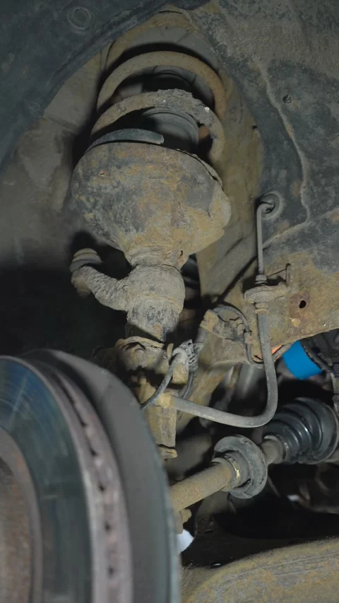 Rusty elements of car suspension. Car shock absorbers and springs. Stock Footage 307618077