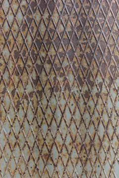 Rusty embossed metal surface with old paint abstract pattern texture background Stock Photos