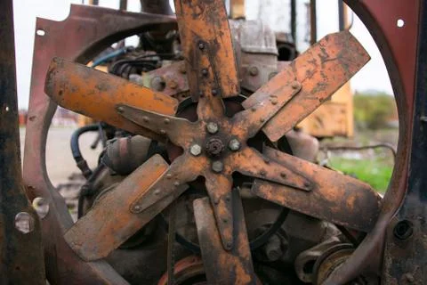 Rusty engine of an old abandoned tractor. Stock Photos