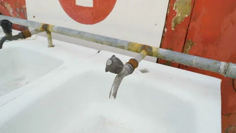 The rusty faucet on the sink outside Stock Footage 140942363