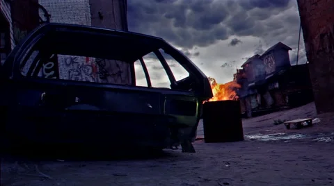 A rusty frame from the machine and a barrel with fire Stock Footage 67708531