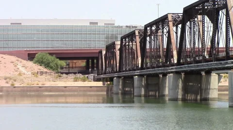 Rusty freight train bridge spans the lake. Stock Footage 53231190