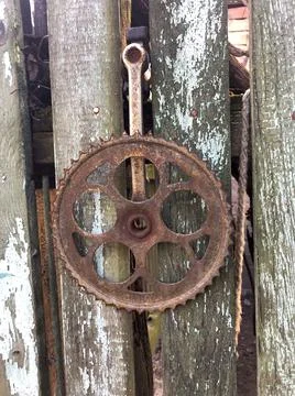 Rusty gear on the boards Stock Photos