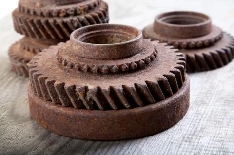 Rusty  gear wheels on a board Stock Photos