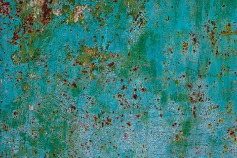 Rusty green metal surface with peeling paint in industrial area Photos