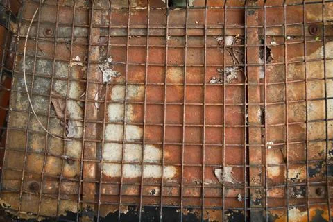 Rusty Grid and Fallen Leaves on Weathered Metal Surface Stock Photos