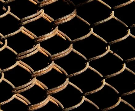 Rusty grid on a black background Stock Photos