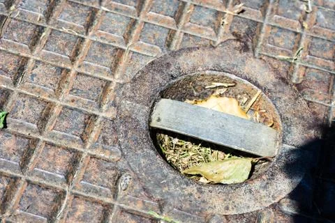 Rusty gully cover close up Stock Photos