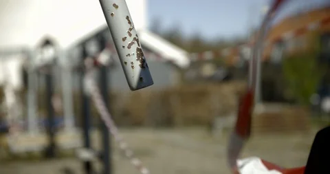Rusty handle focus pull to banning tape on outdoor fitness gym under Corvid 19 Stock Footage 130150322