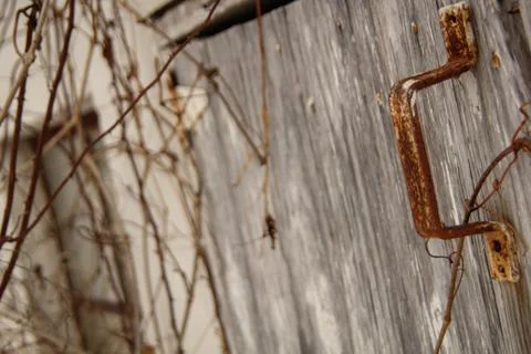 Rusty Handle on an Old, Run Down Building Stock Photos