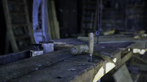 Rusty hardware on aged bench. Closeup of vintage workbench with tools Stock Footage 335594705