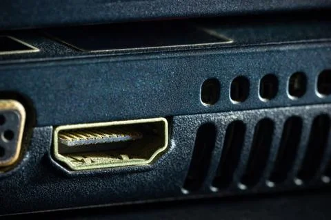 Rusty HDMI port of computer notebook in darkness. Stock Photos