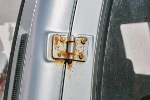Rusty hinge on car door Stock Photos
