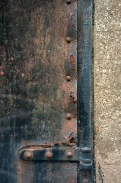 Rusty Hinges and Frame of an Iron Door Stock Photos