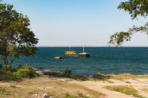 The rusty hull of a long-sunken ship off the coast the Black Sea near the cit Stock-Fotos