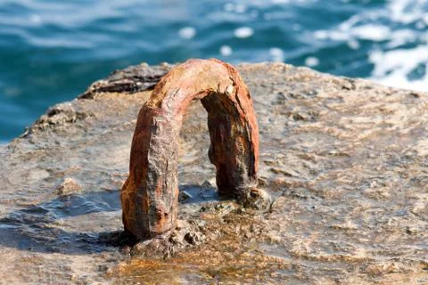 Rusty iron attachment in dock Stock Photos