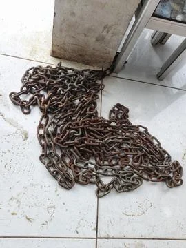 Rusty iron chains on the floor Stock Photos