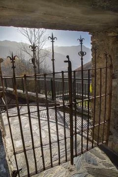 Rusty iron gate framing mountain valley view Stock Photos