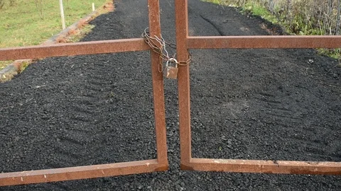 Rusty iron gate locked Stock Footage 118904232