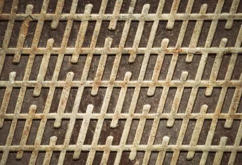 Rusty iron lid with a pattern Stock Photos