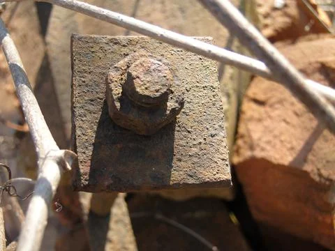 Rusty iron nut on the threaded axle Stock Photos