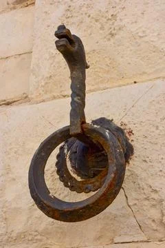 Rusty iron ring on stone wall historic architectural detail Giovinazzo Italy Stock Photos