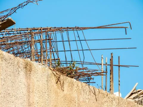 Rusty iron structure on a construction site, on a wall. Stock Photos