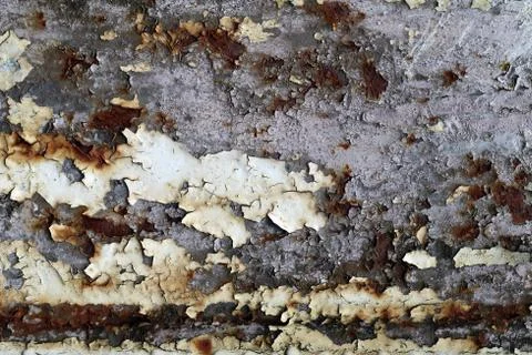 Rusty iron surface with cracks and peeling paint Stock Photos