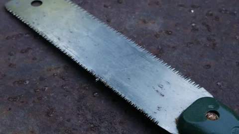 Rusty Japanese Pull Saw on Ground Old Nokogiri Woodworking Tool Stock Footage 325965691