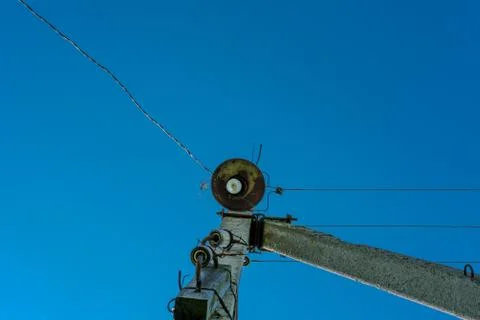 Rusty lamp on an electric pole. Stock Photos