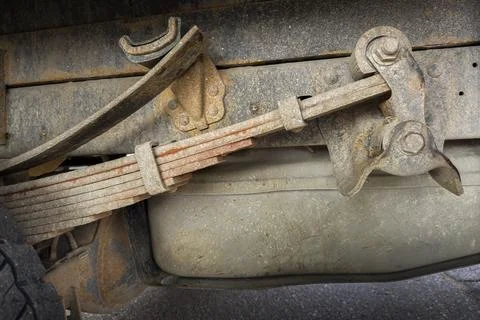 Rusty leaf spring suspension on a truck Stock Photos